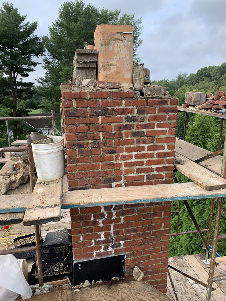 Brick chimney roof damage 4