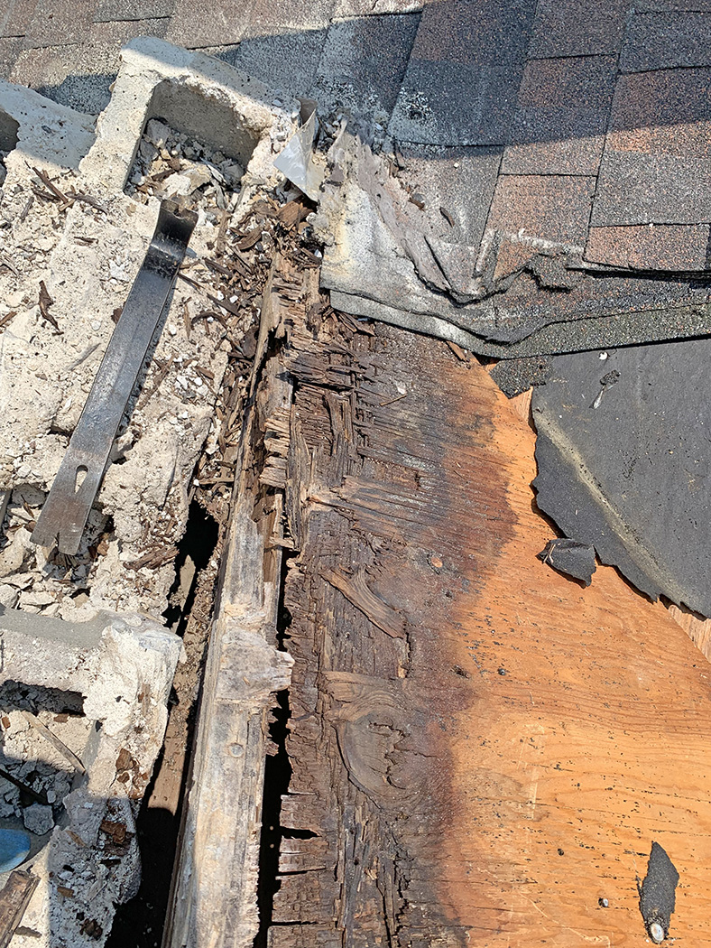 Brick chimney roof damage 2
