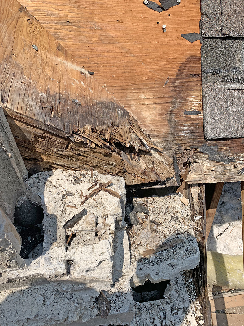 Brick chimney roof damage 1